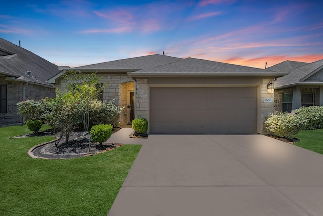 ranch-style house featuring driveway, a lawn, an attached garage, and stone siding