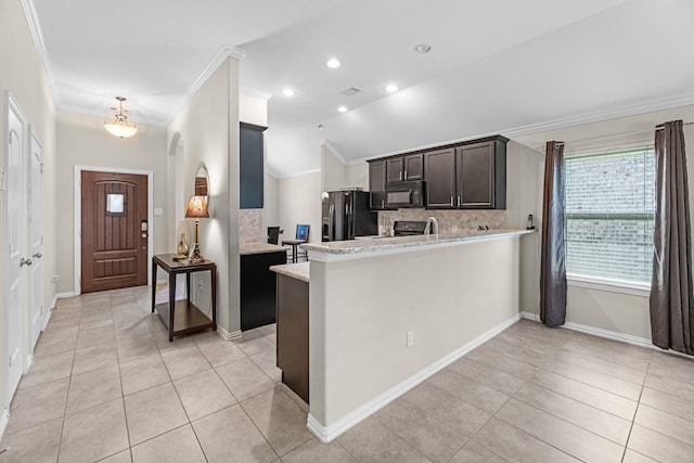 kitchen with light tile patterned floors, tasteful backsplash, black appliances, ornamental molding, and a peninsula