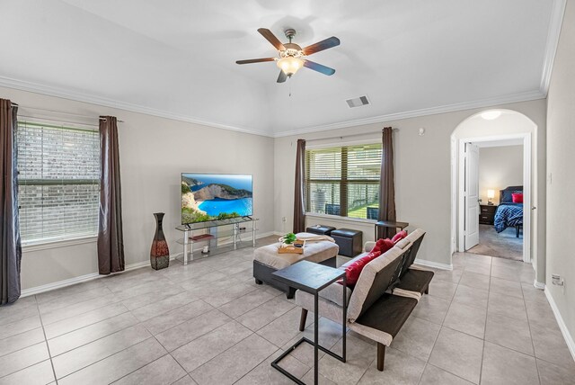 2602 Yellow Pear Way, Fresno, TX 77545 - living room with arched walkways, ceiling fan, light tile patterned floors, plenty of natural light, and crown molding