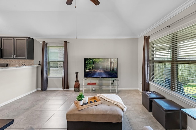 living room featuring light tile patterned floors, a ceiling fan, ornamental molding, and lofted ceiling