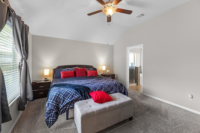 carpeted bedroom featuring connected bathroom, a ceiling fan, visible vents, baseboards, and lofted ceiling
