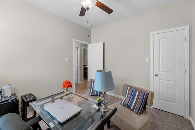 office space with carpet flooring, ceiling fan, and baseboards