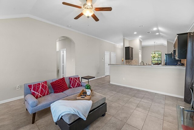 2602 Yellow Pear Way, Fresno, TX 77545 - living area featuring vaulted ceiling, arched walkways, ceiling fan, baseboards, and recessed lighting