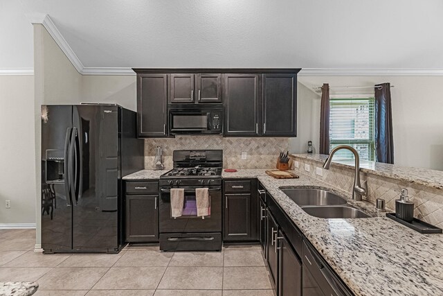 2602 Yellow Pear Way, Fresno, TX 77545 - kitchen with black appliances, a sink, crown molding, decorative backsplash, and light stone countertops