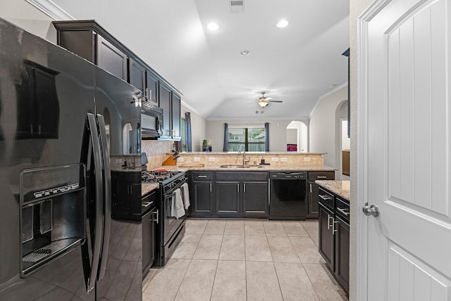 kitchen with arched walkways, black appliances, a sink, a ceiling fan, and a peninsula