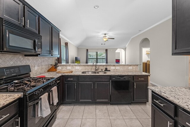 2602 Yellow Pear Way, Fresno, TX 77545 - kitchen featuring black appliances, a sink, a ceiling fan, arched walkways, and decorative backsplash