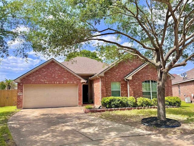 16038 Belleshire Ln, Houston, TX 77084 - view of front of home featuring brick siding, driveway, a garage, roof with shingles, and central AC unit