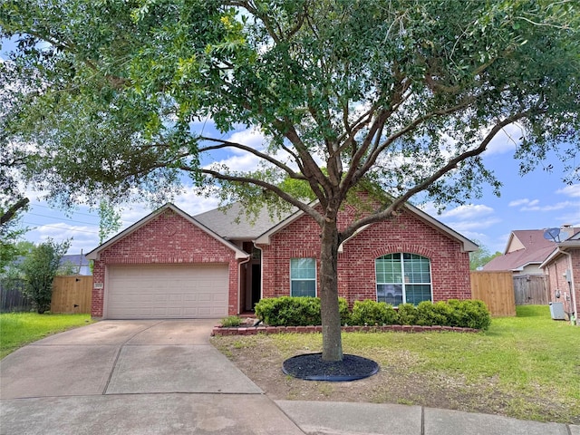 16038 Belleshire Ln, Houston, TX 77084 - ranch-style house featuring brick siding, an attached garage, and concrete driveway