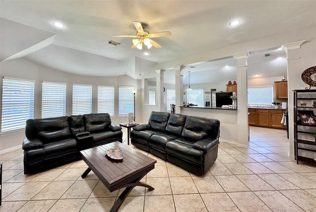 16038 Belleshire Ln, Houston, TX 77084 - living room with ornate columns, a ceiling fan, baseboards, vaulted ceiling, and light tile patterned flooring