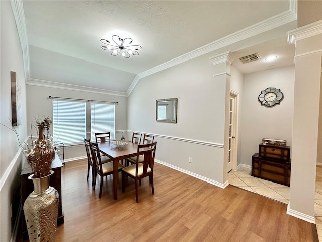 16038 Belleshire Ln, Houston, TX 77084 - dining room with light wood-style floors, crown molding, vaulted ceiling, and baseboards