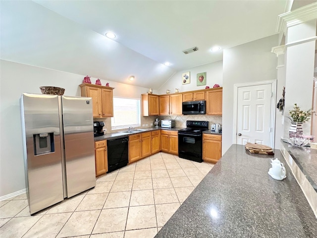 16038 Belleshire Ln, Houston, TX 77084 - kitchen with black appliances, a sink, decorative backsplash, vaulted ceiling, and light tile patterned flooring