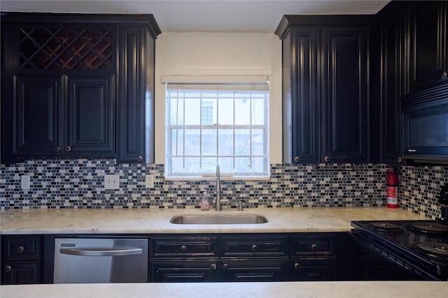 2574 Marilee Ln Unit 1, Houston, TX 77057 - kitchen featuring a sink, dark cabinets, tasteful backsplash, and black appliances
