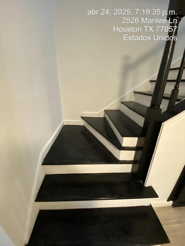 2574 Marilee Ln Unit 1, Houston, TX 77057 - stairway featuring wood finished floors