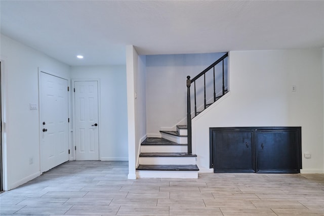 2574 Marilee Ln Unit 1, Houston, TX 77057 - entryway featuring stairs, recessed lighting, baseboards, and wood tiled floor