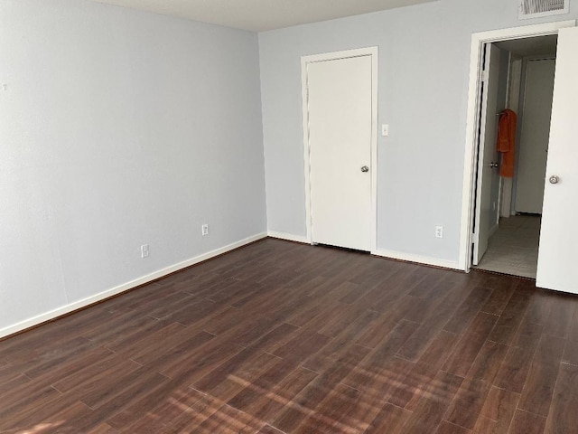 2333 Bering Dr Unit 201, Houston, TX 77057 - spare room featuring dark wood-type flooring, visible vents, and baseboards