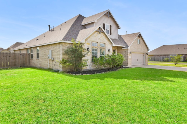 view of front of property featuring a front lawn, a shingled roof, driveway, brick siding, and fence