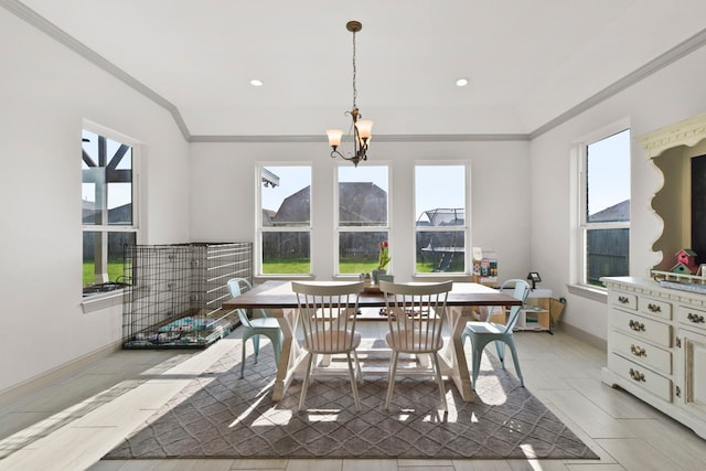 dining area with ornamental molding, baseboards, and plenty of natural light