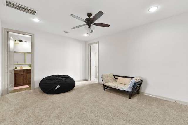living area featuring visible vents, a ceiling fan, recessed lighting, and light carpet
