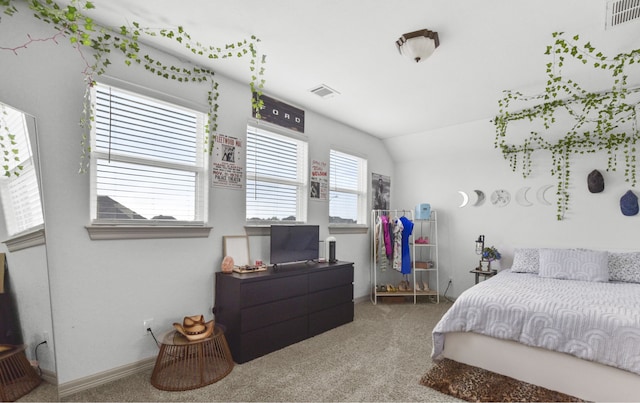 bedroom with visible vents, vaulted ceiling, carpet, and baseboards