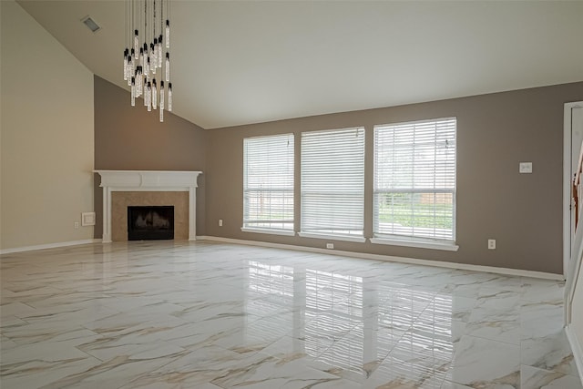 11911 Timpnogos Dr, Tomball, TX 77377 - unfurnished living room featuring high vaulted ceiling, marble finish floor, and baseboards