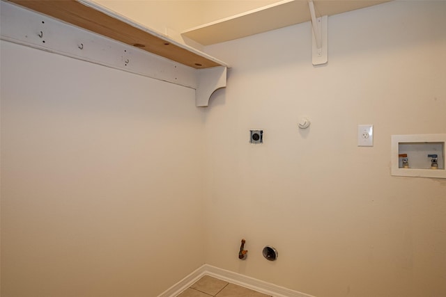 11911 Timpnogos Dr, Tomball, TX 77377 - laundry area with light tile patterned floors, gas dryer hookup, electric dryer hookup, hookup for a washing machine, and laundry area