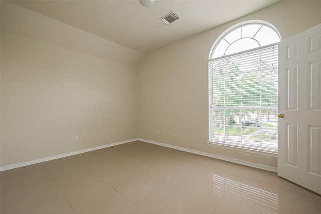11911 Timpnogos Dr, Tomball, TX 77377 - unfurnished room featuring baseboards, visible vents, and vaulted ceiling