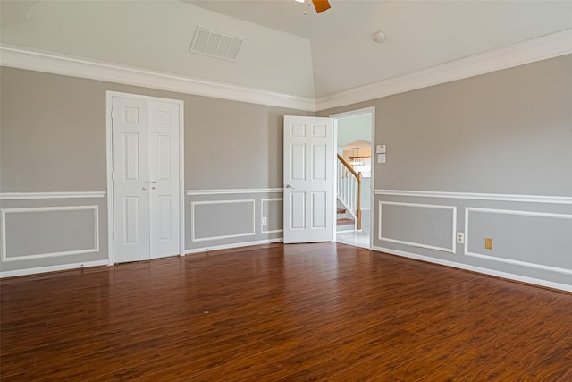 11911 Timpnogos Dr, Tomball, TX 77377 - unfurnished room featuring visible vents, ceiling fan, wainscoting, and a decorative wall