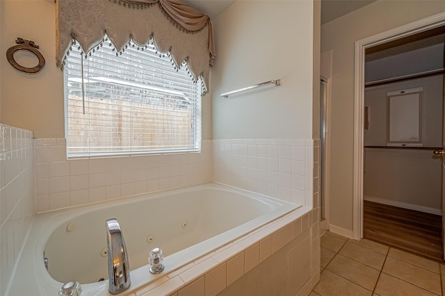 11911 Timpnogos Dr, Tomball, TX 77377 - full bath with tile patterned floors and a whirlpool tub
