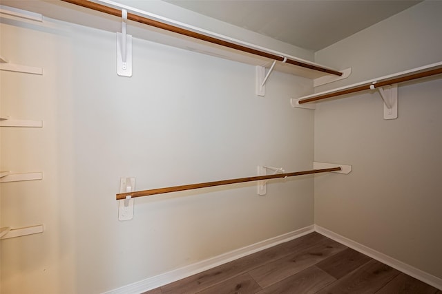 11911 Timpnogos Dr, Tomball, TX 77377 - spacious closet with dark wood-type flooring