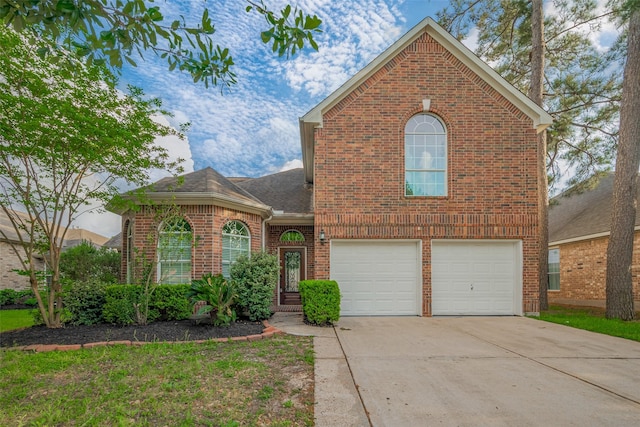 11911 Timpnogos Dr, Tomball, TX 77377 - traditional-style home featuring driveway, a shingled roof, brick siding, and a garage