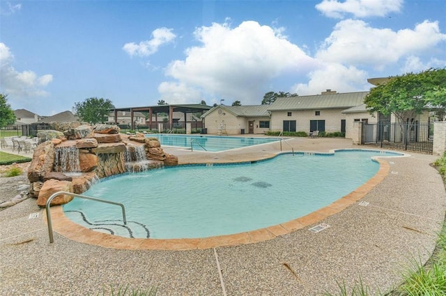 11911 Timpnogos Dr, Tomball, TX 77377 - pool with a patio and fence