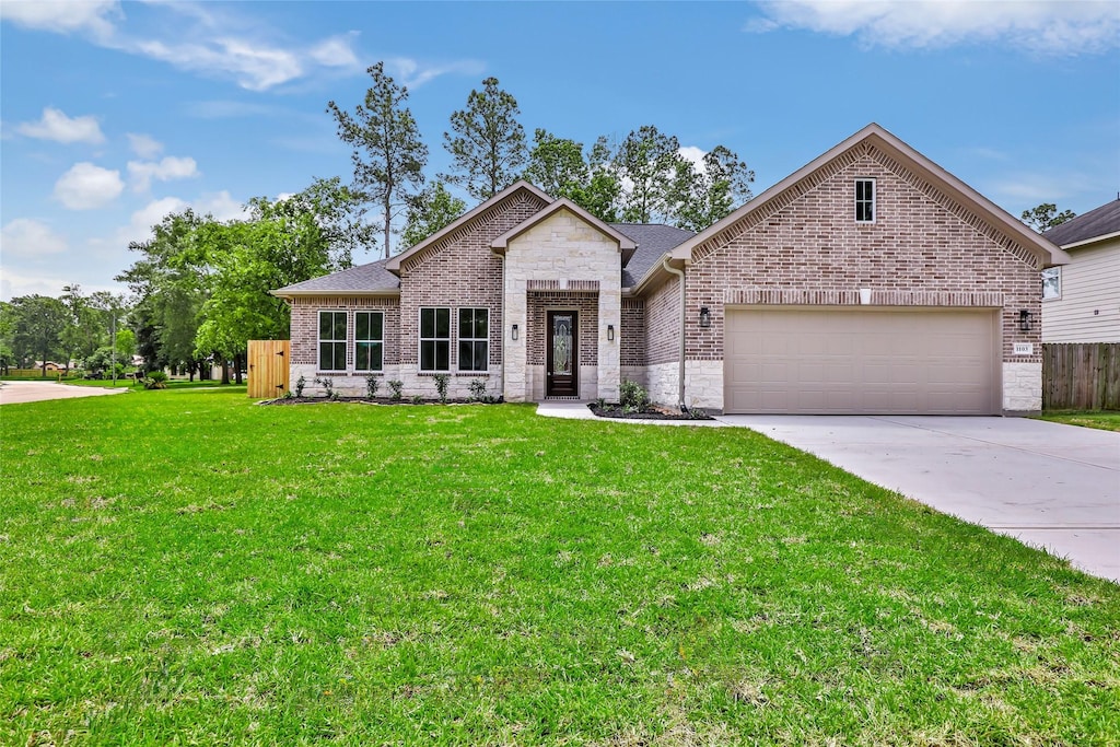 1103 Channels Ct, Crosby, TX 77532 - view of front of home featuring brick siding, a garage, concrete driveway, and roof with shingles