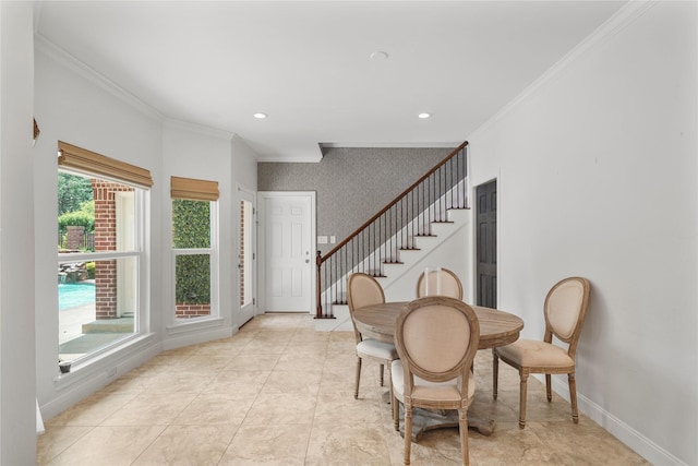 sitting room with baseboards, ornamental molding, and wallpapered walls