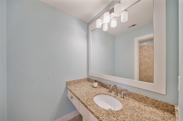 bathroom featuring visible vents and vanity