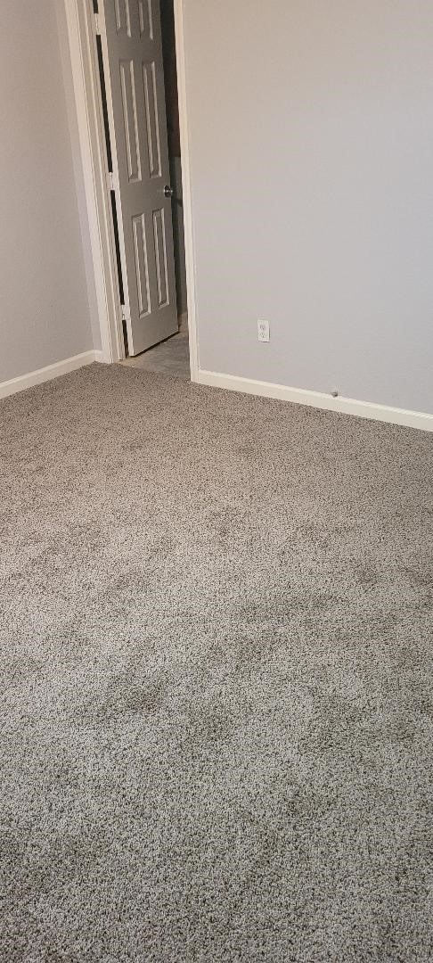 9227 Lake Park Dr, Houston, TX 77078 - empty room featuring carpet floors and baseboards