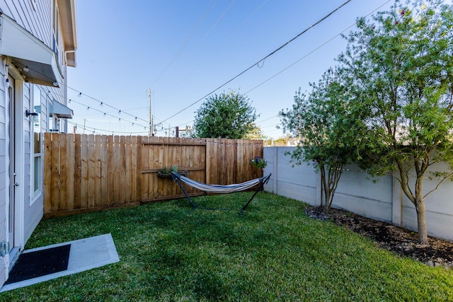 view of yard featuring a fenced backyard