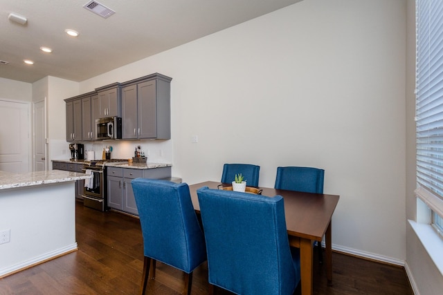 dining space with visible vents, recessed lighting, dark wood finished floors, and baseboards
