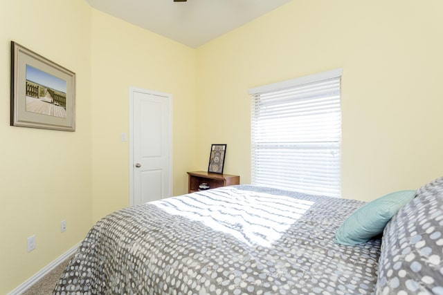 bedroom featuring carpet flooring and baseboards
