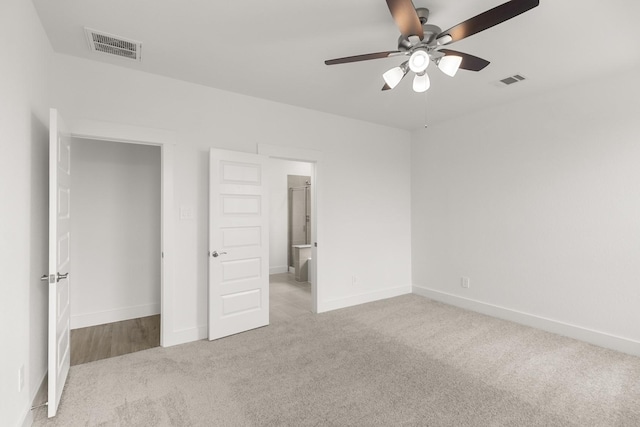 unfurnished bedroom with visible vents, ceiling fan, carpet flooring, and baseboards