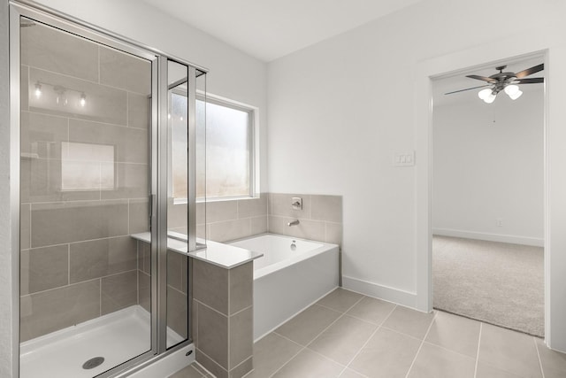 full bath with a garden tub, a stall shower, tile patterned flooring, and ceiling fan