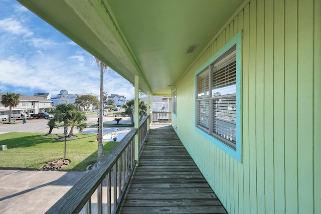 205 Bora Bora Dr, Tiki Island, TX 77554 - wooden deck with a lawn and a residential view