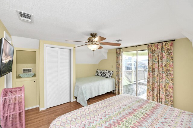 205 Bora Bora Dr, Tiki Island, TX 77554 - bedroom with access to outside, wood finished floors, a closet, ceiling fan, and vaulted ceiling