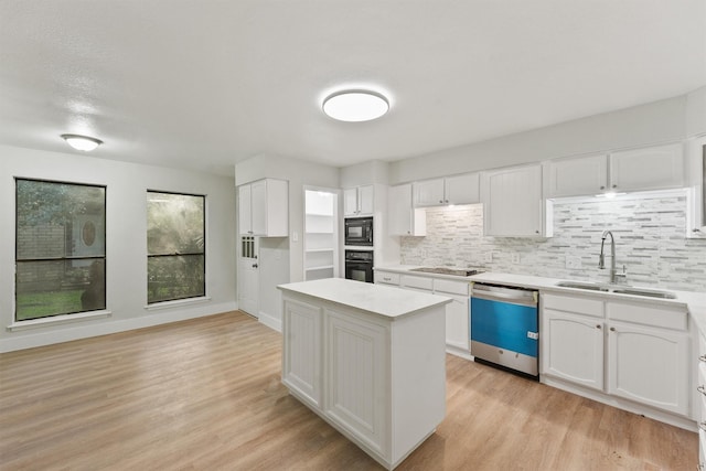 18118 Lakeside Ln, Houston, TX 77058 - kitchen featuring black appliances, a sink, light countertops, and backsplash