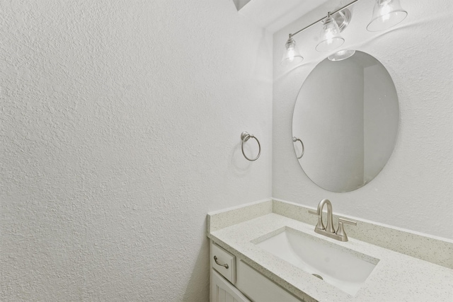 18118 Lakeside Ln, Houston, TX 77058 - bathroom featuring vanity and a textured wall
