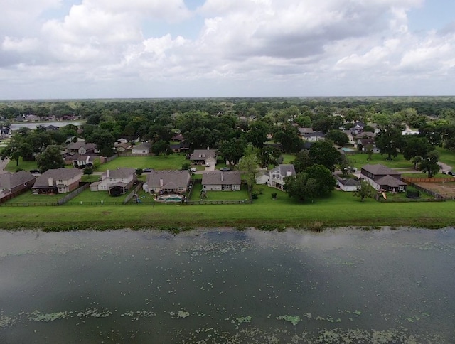 drone / aerial view with a residential view and a water view