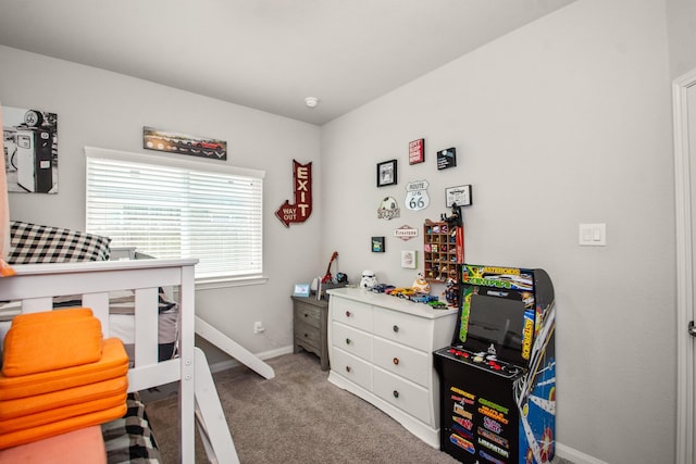 bedroom featuring baseboards and carpet floors