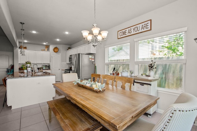 dining area with recessed lighting, tile patterned flooring, and an inviting chandelier
