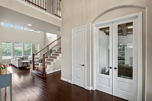 27803 Indigo Pointe Ln, Katy, TX 77494 - foyer featuring a high ceiling, stairway, dark wood-type flooring, and baseboards
