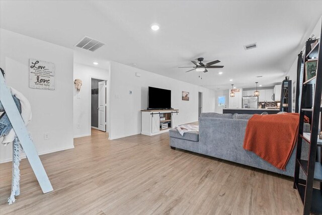126 Spring Rose Dr, Magnolia, TX 77354 - living area with ceiling fan, light wood-style flooring, recessed lighting, and baseboards