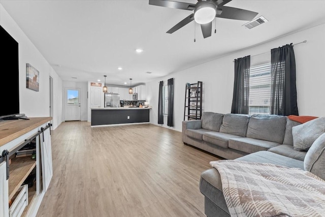 126 Spring Rose Dr, Magnolia, TX 77354 - living room with light wood-style floors, ceiling fan, and recessed lighting